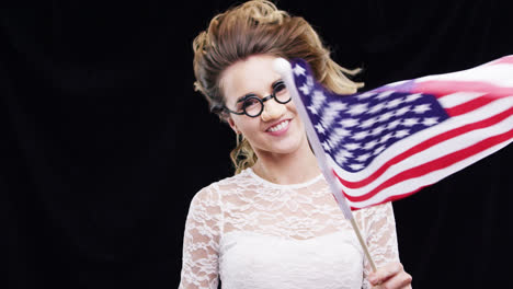 Woman-waving-American-flag-independence-day-celebration-slow-motion-party-photo-booth