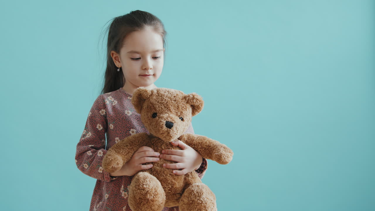 Adorable Little Girl with Plush Toy