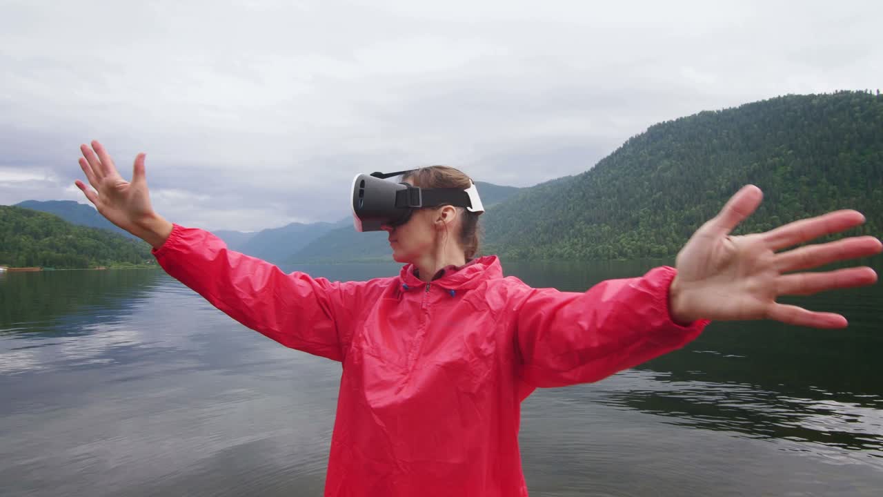 Woman experiencing virtual reality by a lake