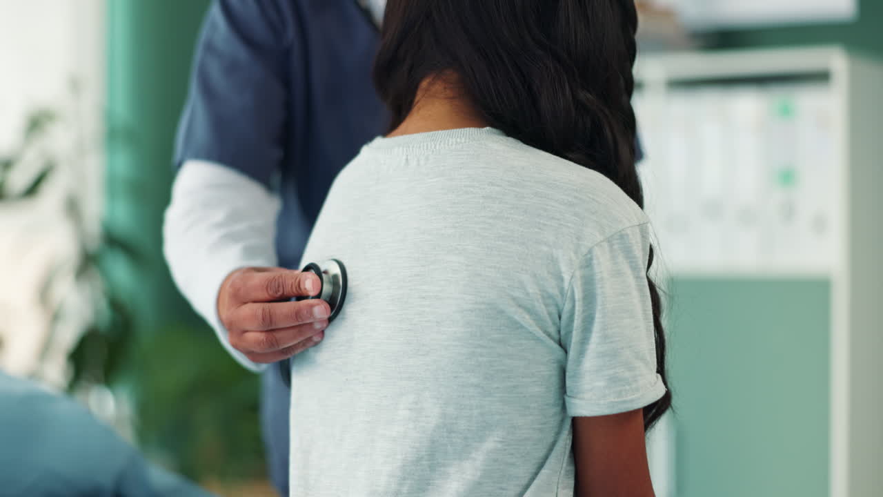Doctor examining a child with a stethoscope