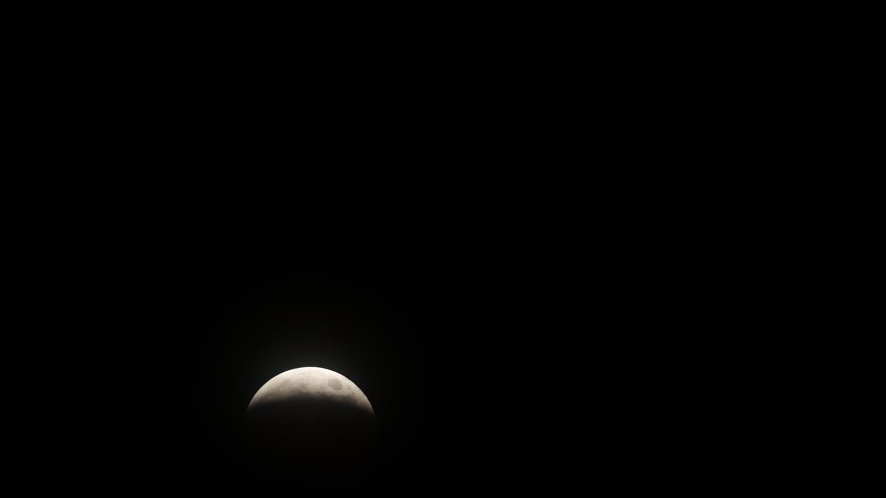 Timelapse of the beginning of the Total Lunar Eclipse on March 14th, 2025 as the moon gets covered in Earth's shadow