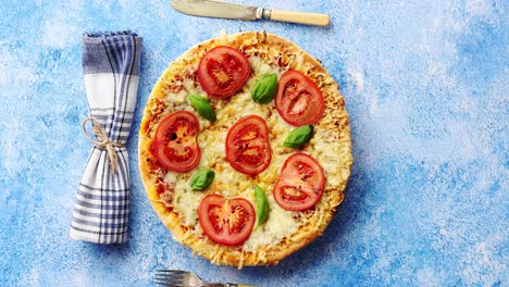 delicious italian pizza served on blue stone table  shot from above