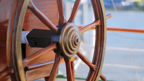 close up of an old wodden ship's steering wheel of a traditional european sailing ship rickmer rickmers from the 19th century