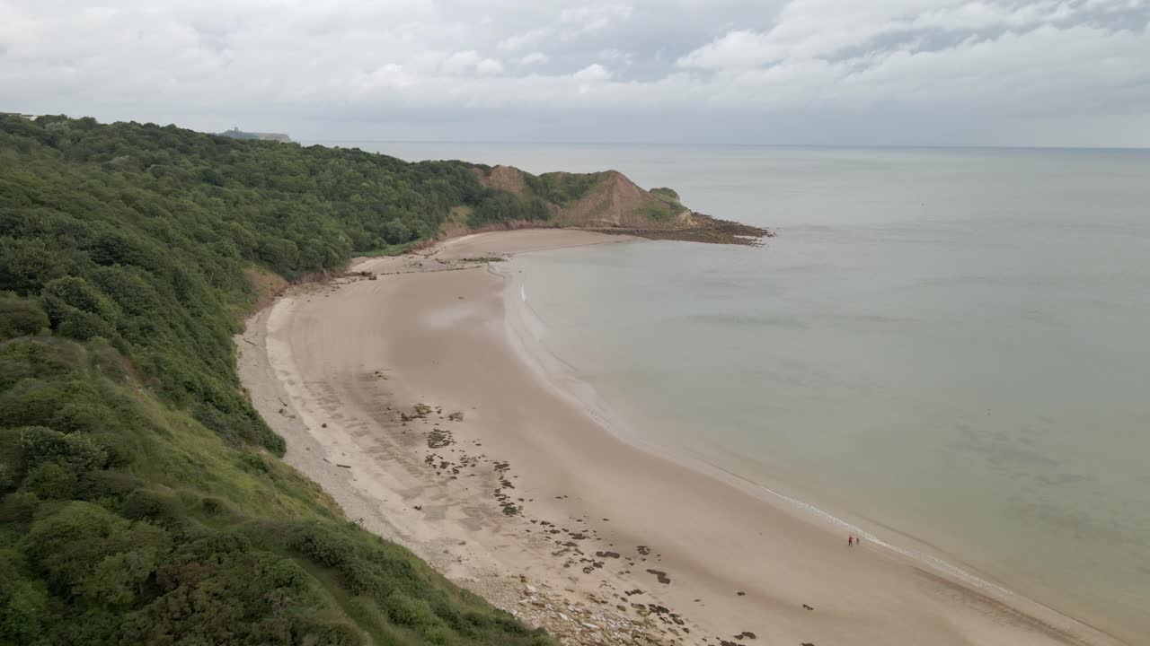 Aerial drone shot over Cayton bay, Scarborough, North Yorkshire on a cloudy day