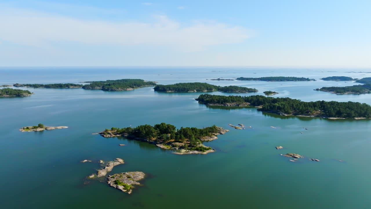 Aerial view backwards over islands in the Archipelago National park of Finland