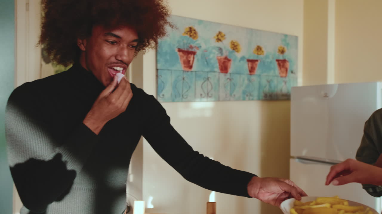 People eating fries indoors