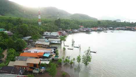 Drone-Flight-Over-The-Coast-Of-Old-Town-Koh-Lanta-With-Views-Of-Stilt-Homes-And-Long-Tail-Boats