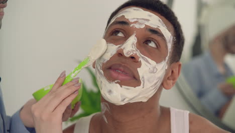 Portrait-Of-A-Black-Man-Having-Facial-Mask-Applied