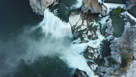 birds eye aerial view of spectacular shoshone falls over steep cliff