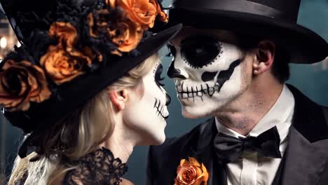 a man and a woman dressed up as skeletons in a wedding dress and top hat