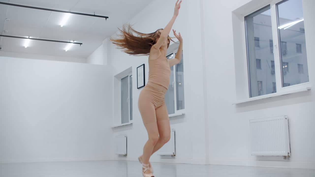 Ballet dancer practicing in studio