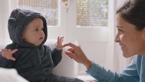 happy mother playing with baby wearing funny costume loving mom having fun with cute toddler at home parent bonding with child enjoying motherhood childcare