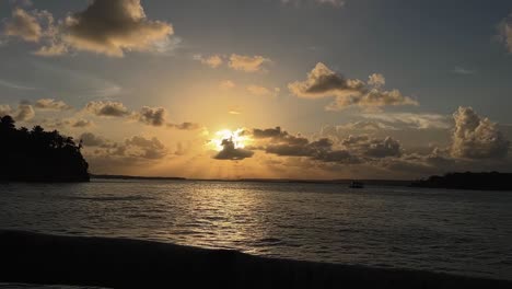 stunning landscape shot of a beautiful golden tropical sunset on the guaraíras lagoon from the famous tourist destination tibau do sul, brazil near pipa in rio grande do norte on a summer evening