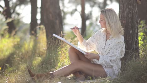 a young artist is discovering their inspiration outdoors while being surrounded by lush trees and - a young artist is discovering their inspiration outdoors while being surrounded by lush trees and beautiful nature