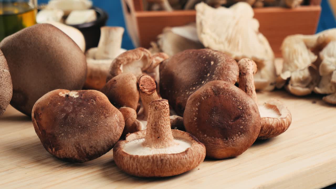 Assorted Mushrooms on a Wooden Cutting Board