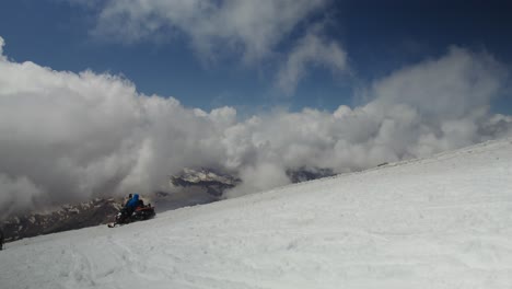 snowmobile adventure on a mountain summit