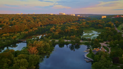slow-moving drone view of the huron river in ann arbor, michigan, captured in summer.