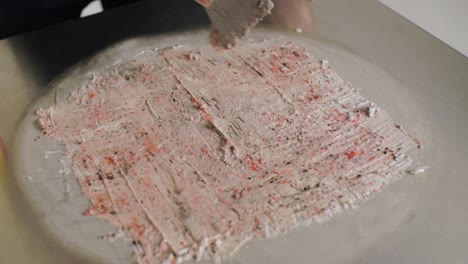 making strawberry cookie ice cream on a hot plate