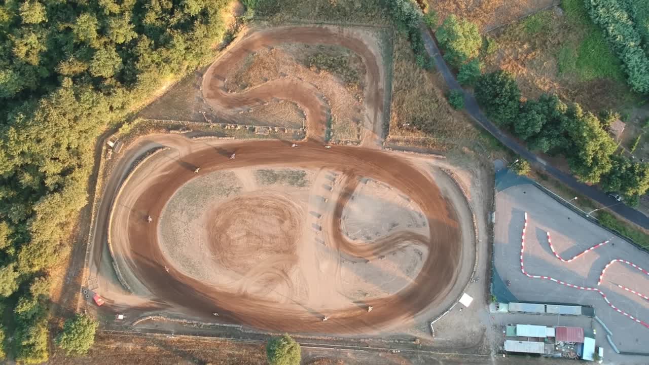 Aerial View of Motocross Riders on a Dirt Track
