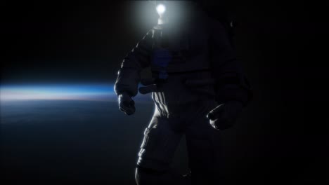 astronauta en el espacio exterior con el telón de fondo del planeta tierra. imagen de la tierra proporcionada por la nasa