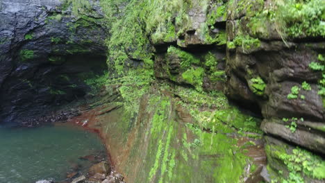 massive rock wall beside of a untouched waterfall in brazil