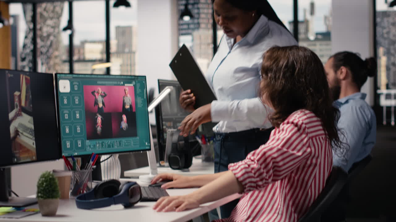 Creative Women Collaborating on Computer Project in Modern Office