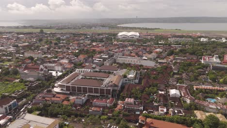 panoramic aerial view of kuta, bali – sweeping right over tourism and residential areas. indonesia.
