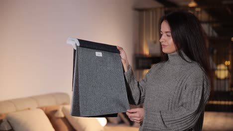 smilling woman picking upholstery material in furniture store smilling woman picking upholstery material in furniture store high quality footage