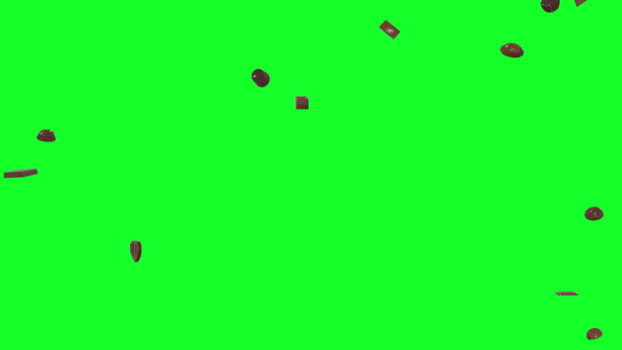 다양한 사탕, 초콜릿이 하늘에서 녹색 화면으로 떨어집니다.