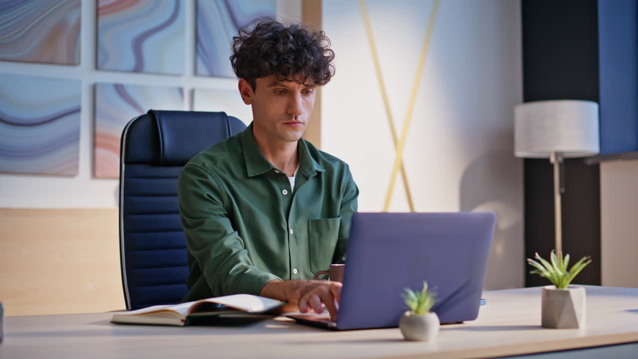 Focused copywriter working laptop at home workspace closeup. Serious manager
