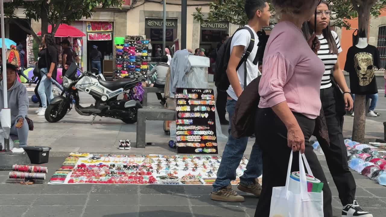 People purchasing goods in historic district of Mexico City