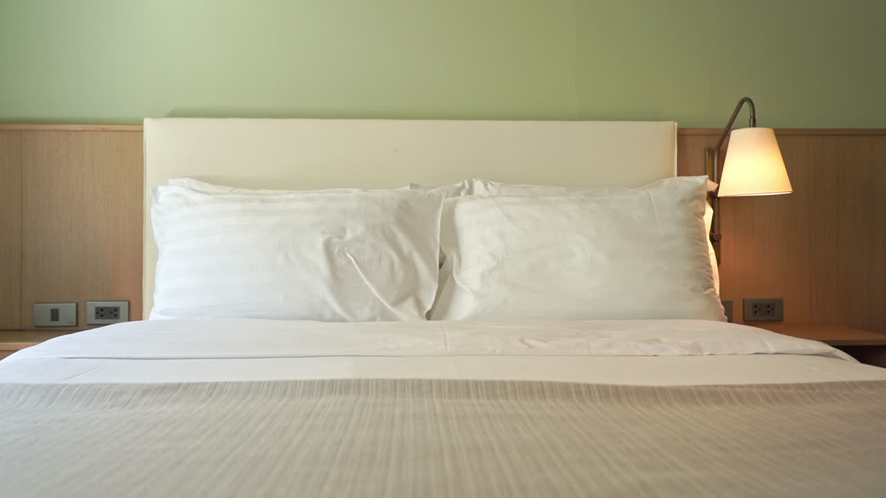 Empty Kingsize Double Bed Bedroom, White Sheets and Pillows, Pan Right