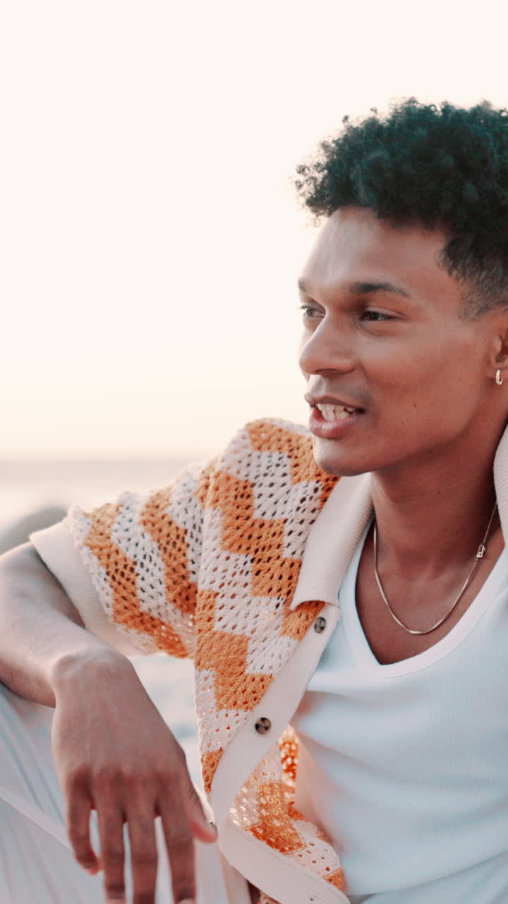 Young Man Talking and Gesturing Outdoors in Warm Light
