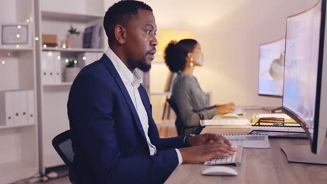 Business,-night-and-black-man-typing-on-computer