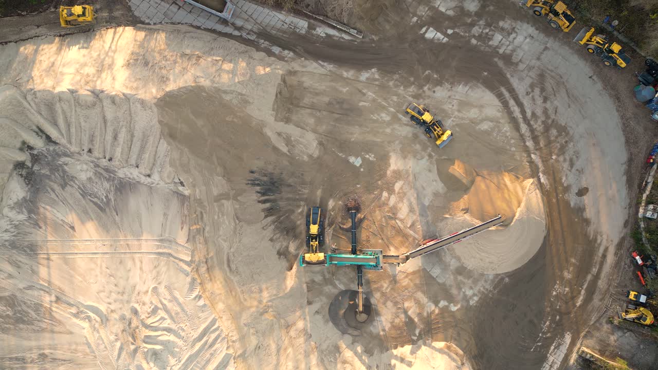 Mining truck transporting sand at sand quarry aerial view of mining machinery moving at sand mine top view of mining equipment at sand mine mining industry heavy vehicle at sandpit