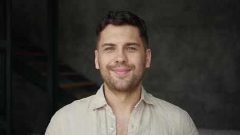 Young-Man-Smiling-And-Laughing,-Looking-At-Camera-Indoors