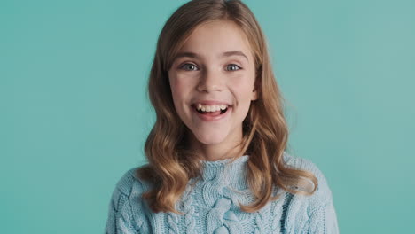 excited teenage caucasian girl in front of the camera.