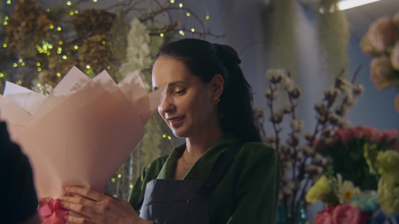 Florist making a bouquet in a flower shop