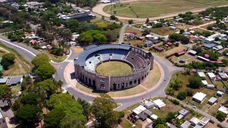 aerial orbit of the arena of the bullring of colonia del sacramento in uruguay, sunny day