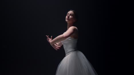 beautiful ballet dancer spinning around in tutu skirt. ballerina dancing stage.