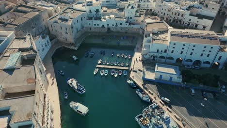 Fishing-boats-moored-in-the-small-Marina-the-Italian-city-Monopoli-on-a-sunny-day