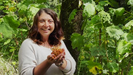 Authentic,-no-makeup-woman-is-happy-and-smiling-after-picking-up-edible-black-poplar-mushrooms-in-the-forest