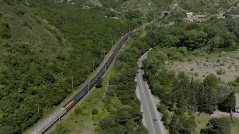 industrial train with hopper wagons transporting coal in mtskheta, georgia