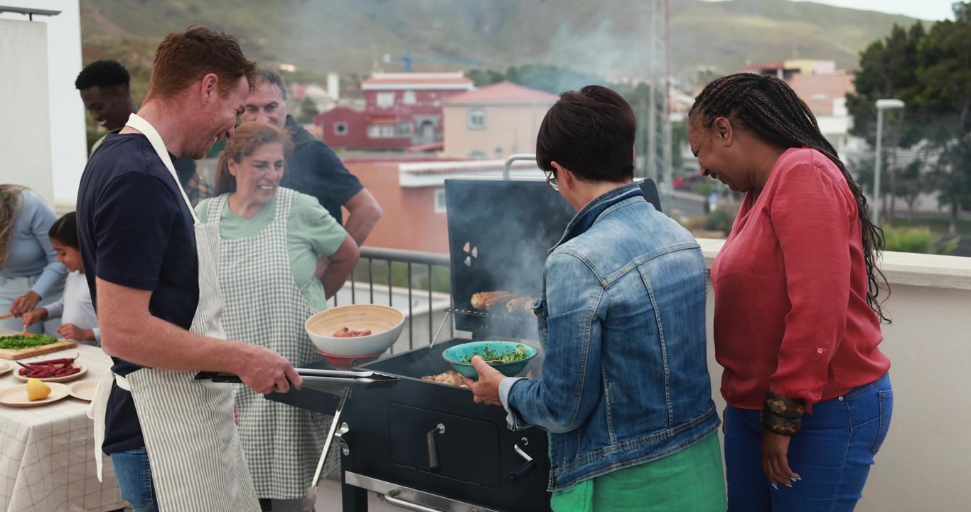 Diverse Group of Friends Grilling on a Rooftop Terrace
