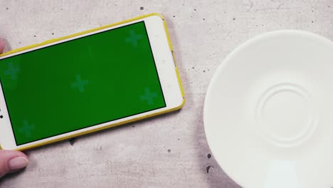 on the table mobile phone and a cup of coffee top view