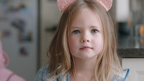 portrait beautiful little girl wearing cute cat ears having fun at home playing dress up enjoying childhood imagination