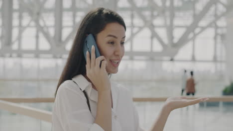 woman talking on phone in modern building