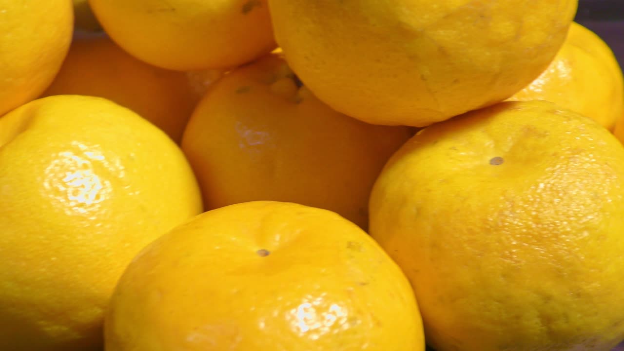 Fresh Oranges stacked on each other.