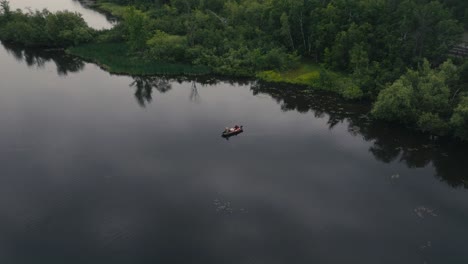 Boat-On-Tranquil-Water-Of-Magog-River-In-Sherbrooke,-Quebec-Canada