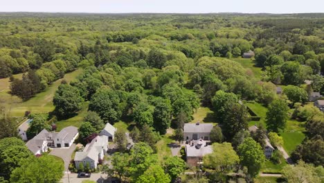 Extended-sideways-drone-shot-along-the-foliage-lined-historic-district-on-Main-Street-in-Hingham,-MA,-USA